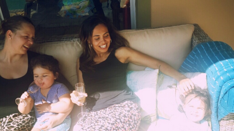 Sharing laughs and enjoying the sun with our girls: Little EJ and I enjoying a good vintage....(and for non-humourous readers, thats good ol' H2O in little EJ's glass)